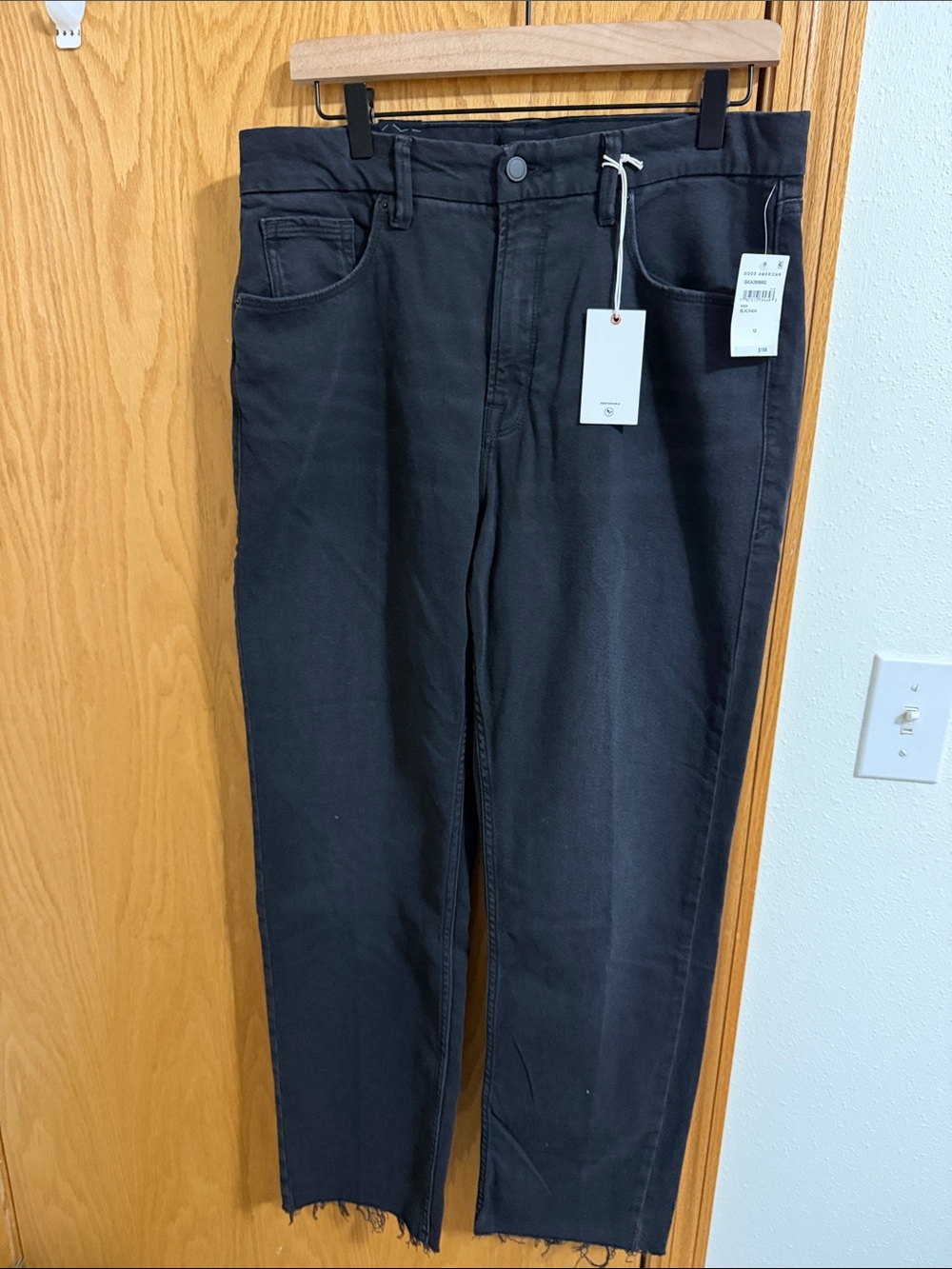 Good American Black Straight Jeans with Raw Hem